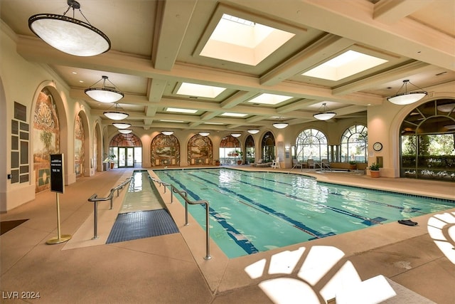 view of pool featuring a skylight