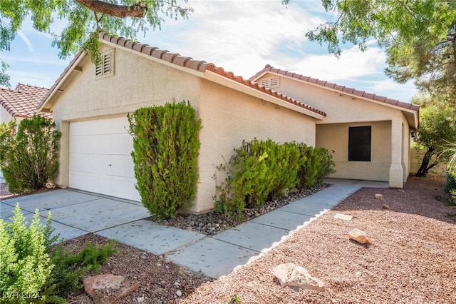 view of side of property featuring a garage