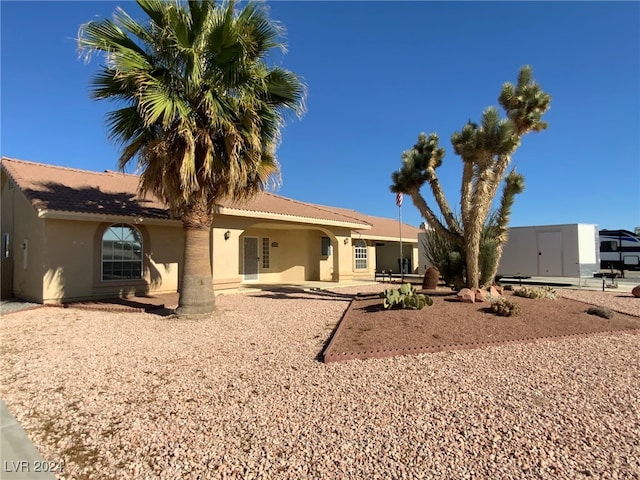 back of house with a patio