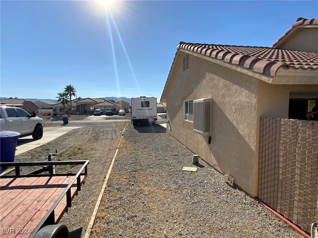 view of home's exterior featuring a deck