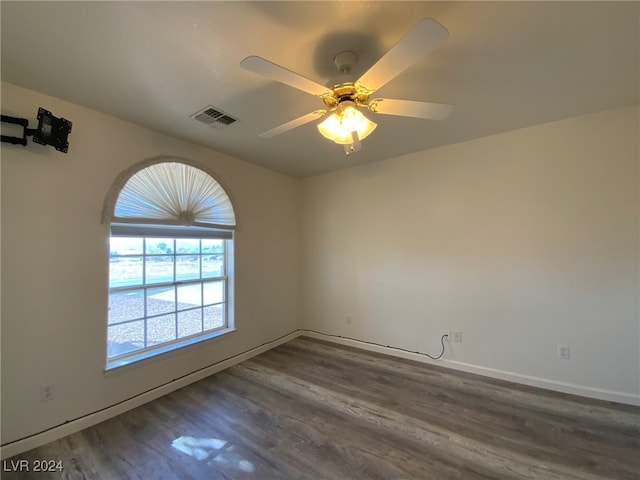 unfurnished room with ceiling fan and hardwood / wood-style flooring