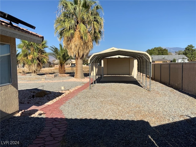 exterior space with a carport