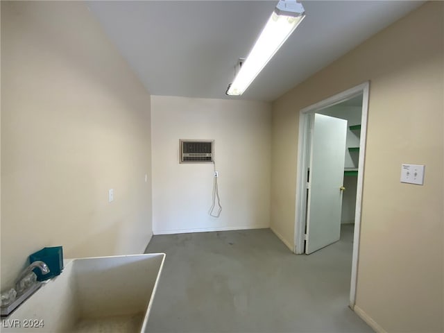 carpeted spare room with a wall mounted AC