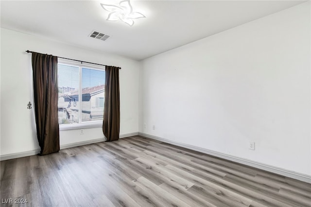 spare room featuring light wood-type flooring