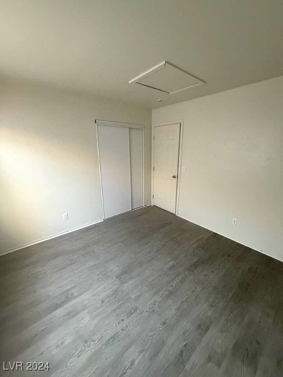 unfurnished room with hardwood / wood-style floors