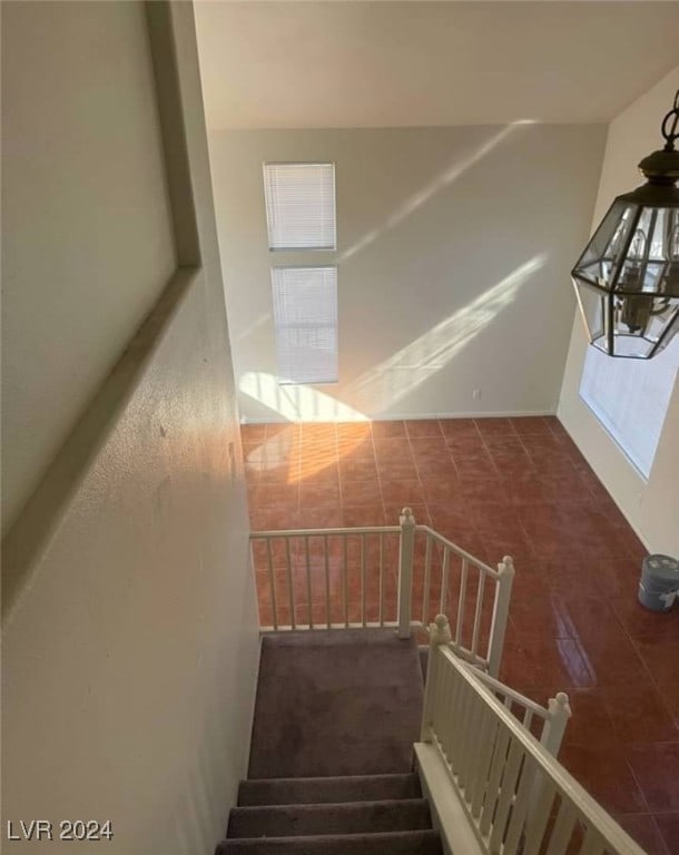 staircase with a wealth of natural light