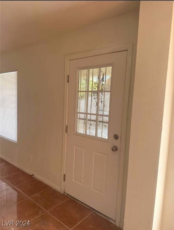 entryway with tile patterned floors