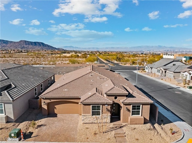 birds eye view of property featuring a mountain view