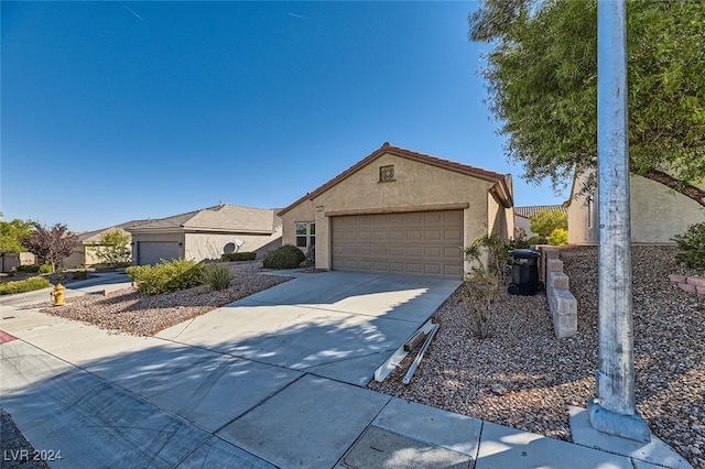 ranch-style house featuring a garage