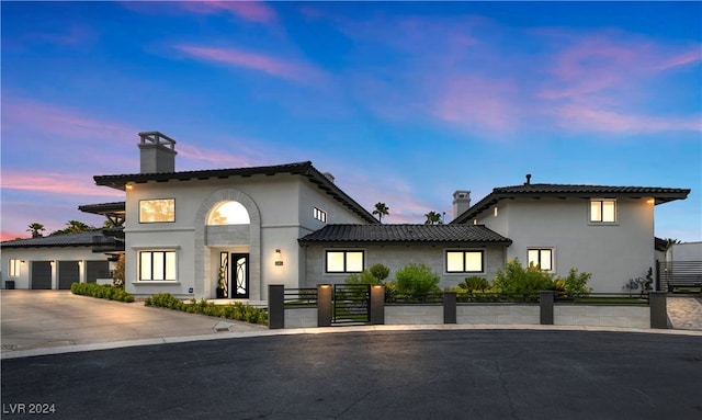 mediterranean / spanish-style house featuring a garage