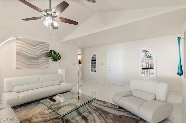 living room with vaulted ceiling, light tile patterned floors, and ceiling fan