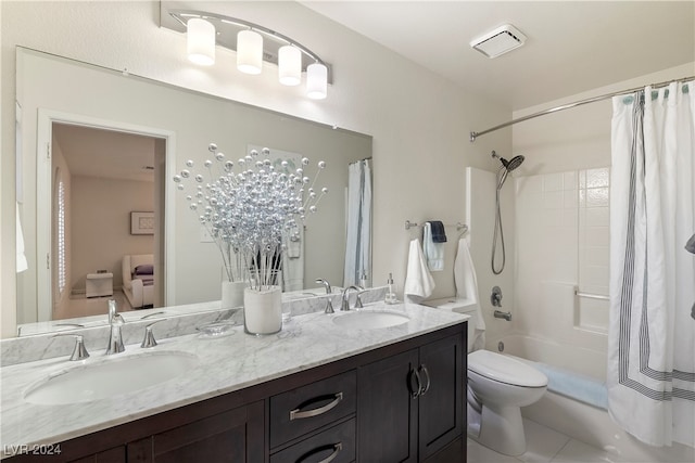 full bathroom featuring tile patterned flooring, shower / bath combo, vanity, and toilet