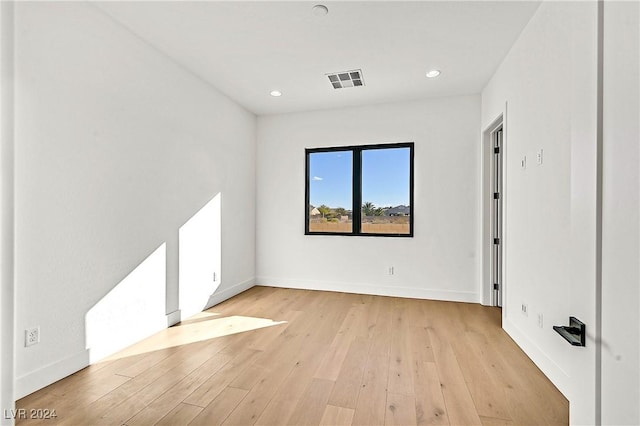 unfurnished room featuring light hardwood / wood-style floors