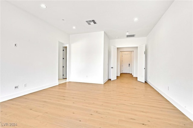 unfurnished room with light hardwood / wood-style floors