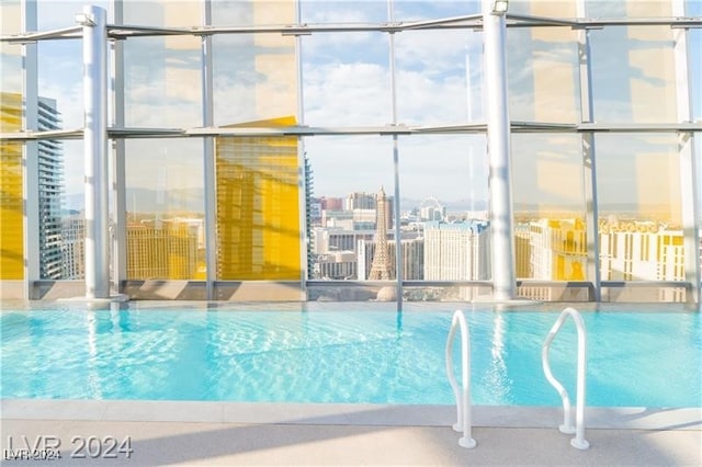 view of pool with pool water feature