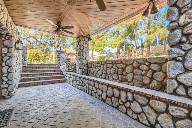 view of patio featuring ceiling fan