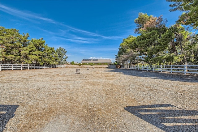 view of yard with a rural view