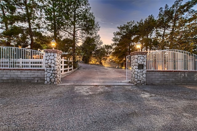 view of gate at dusk