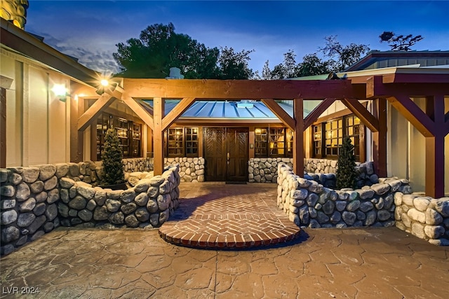 view of patio terrace at dusk