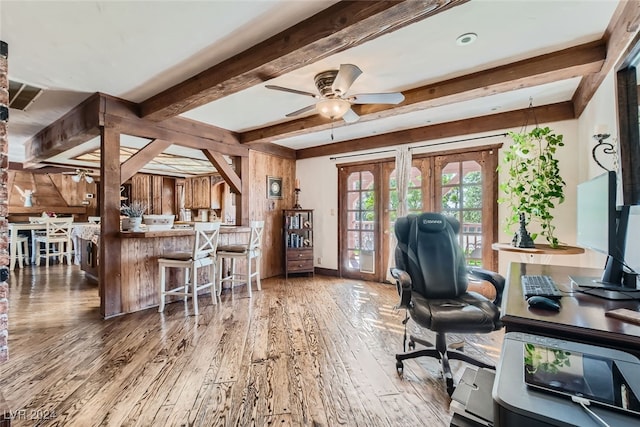 office area with wood-type flooring, beam ceiling, and ceiling fan