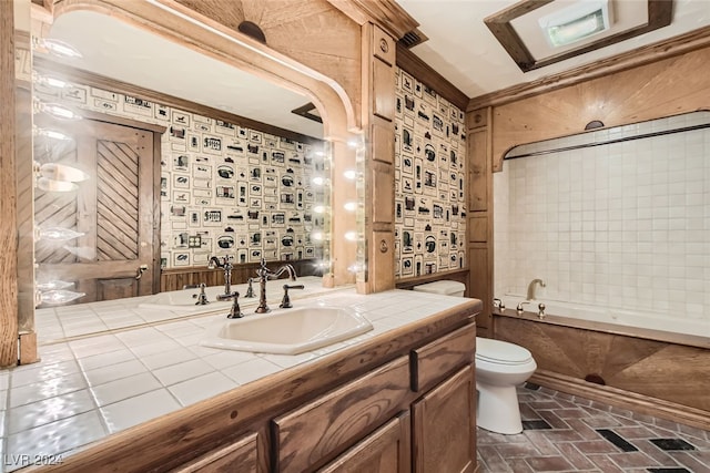 full bathroom featuring ornamental molding, bathtub / shower combination, toilet, and vanity