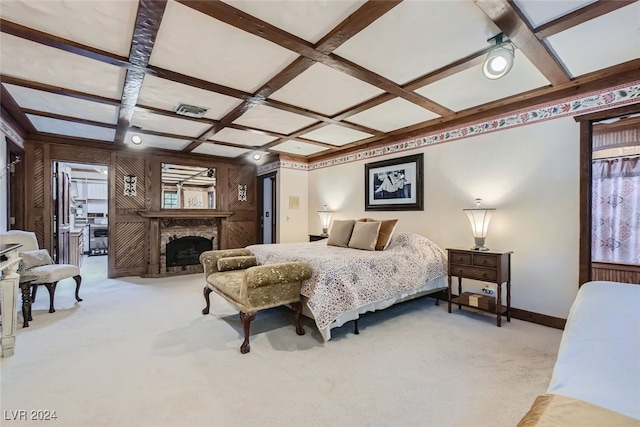 bedroom featuring coffered ceiling, light colored carpet, and beam ceiling