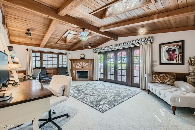 office with ceiling fan, carpet, a wealth of natural light, and lofted ceiling with skylight