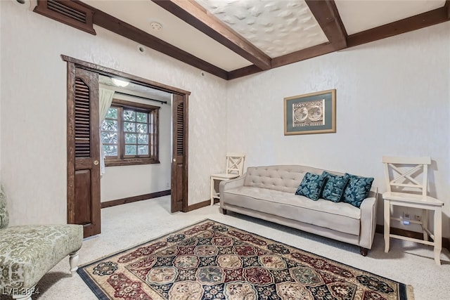 living room featuring beamed ceiling