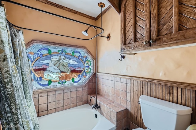 bathroom with ornamental molding, toilet, and shower / tub combo with curtain