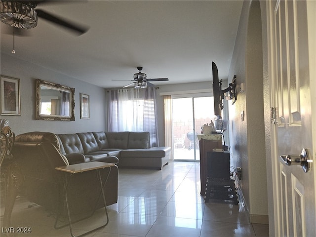 tiled living room with ceiling fan