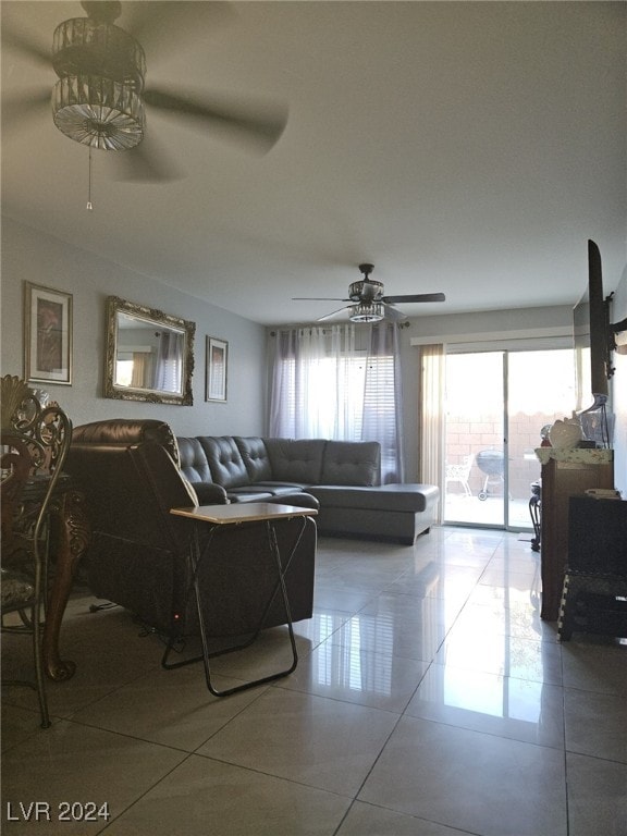 tiled living room featuring ceiling fan