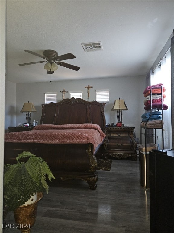 bedroom featuring ceiling fan and dark hardwood / wood-style flooring