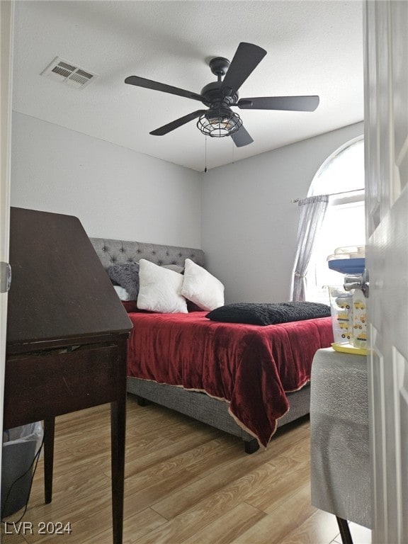 bedroom featuring hardwood / wood-style floors and ceiling fan