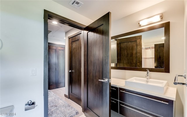 bathroom featuring tile patterned flooring and vanity