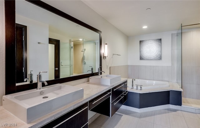 bathroom with vanity, plus walk in shower, and tile patterned flooring