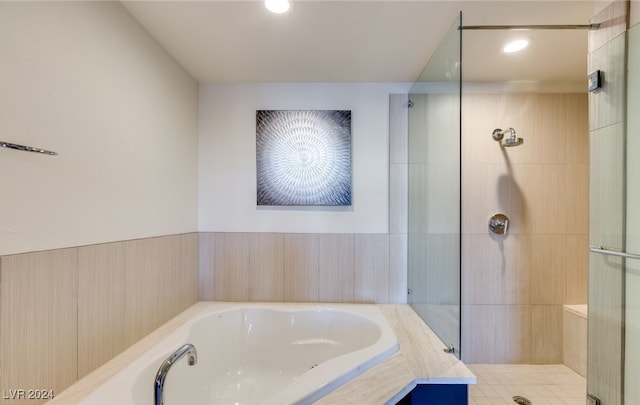 bathroom with shower with separate bathtub