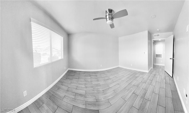 unfurnished room featuring light hardwood / wood-style flooring and ceiling fan