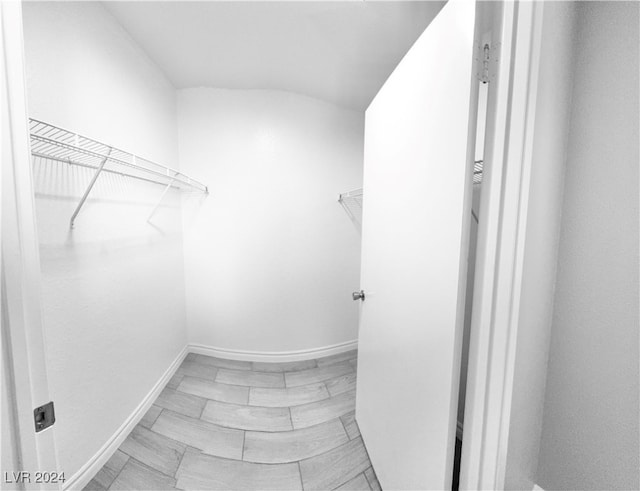 spacious closet featuring light tile patterned floors