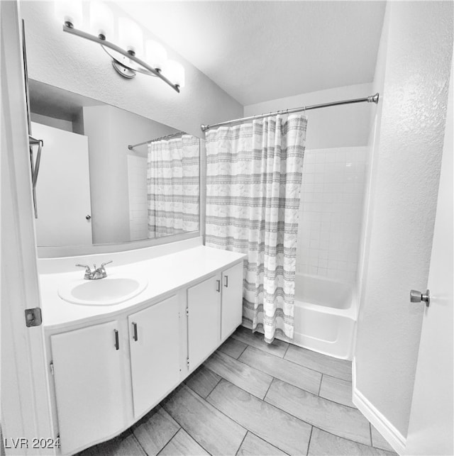 bathroom with vanity and shower / bathtub combination with curtain