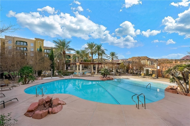 view of swimming pool with a patio area