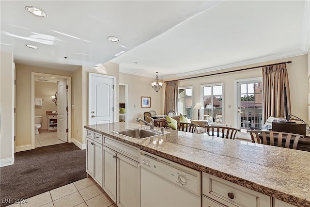 kitchen with light carpet, decorative light fixtures, sink, dishwasher, and ornamental molding