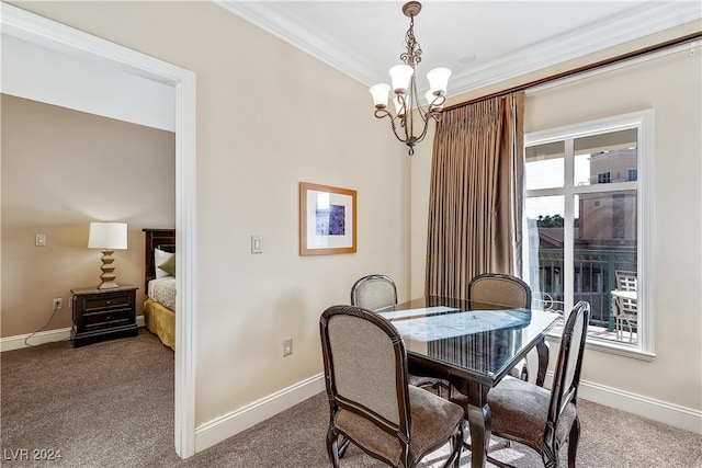 dining space featuring carpet floors, crown molding, and a notable chandelier