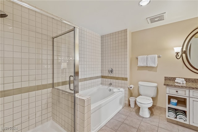 full bathroom with plus walk in shower, tile patterned floors, vanity, and toilet