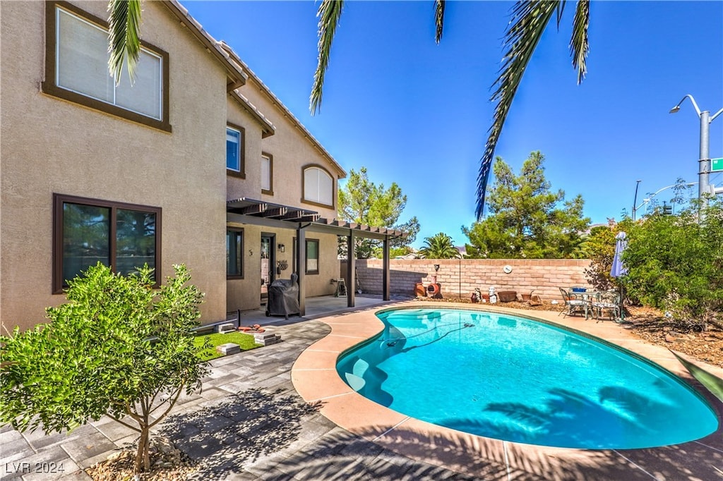 view of pool featuring a patio and a pergola