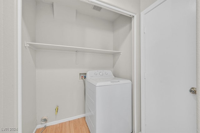 laundry room featuring washer / clothes dryer and hardwood / wood-style flooring