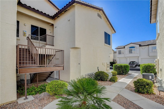 view of property exterior featuring central AC