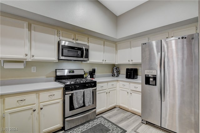 kitchen with stainless steel appliances and light wood-type flooring