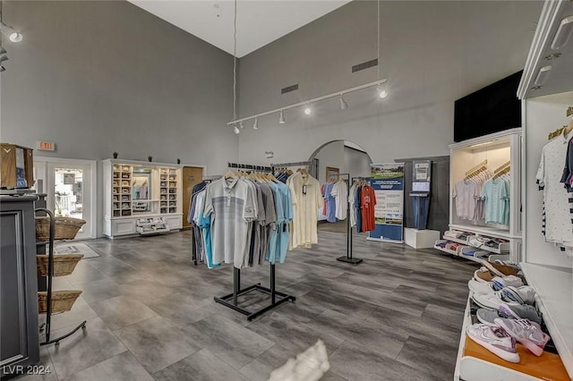 4810 Black Bear Rd Unit 202, Las Vegas, NV 89149 - exercise room with a high ceiling and rail lighting