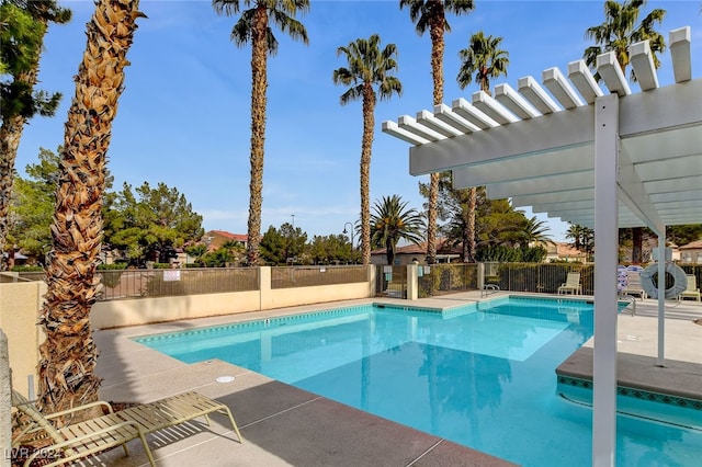 view of swimming pool with a patio area and a pergola