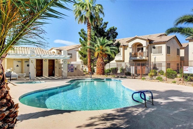 4810 Black Bear Rd Unit 202, Las Vegas, NV 89149 - community pool with a community hot tub and a patio
